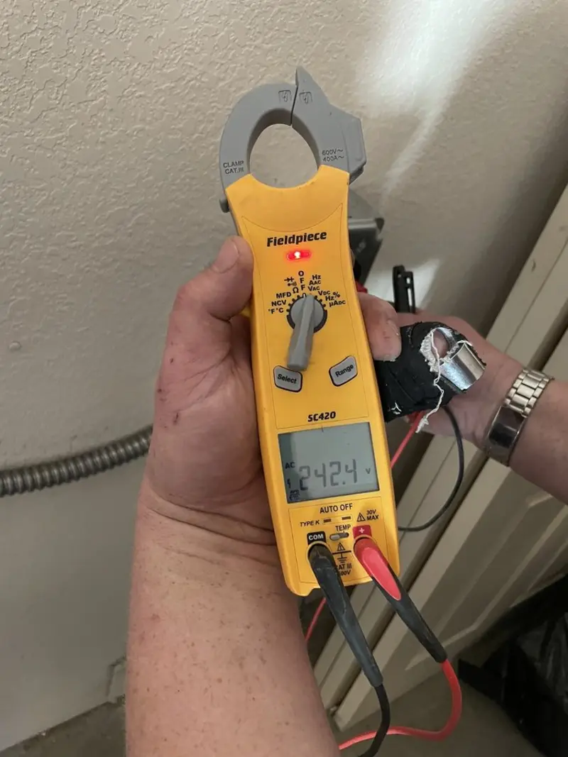 Voltage testing with clamp meter during Electrical Installation Services in Bunnell